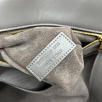 Gray suede interior label with "SAINT LAURENT" and model text on tag