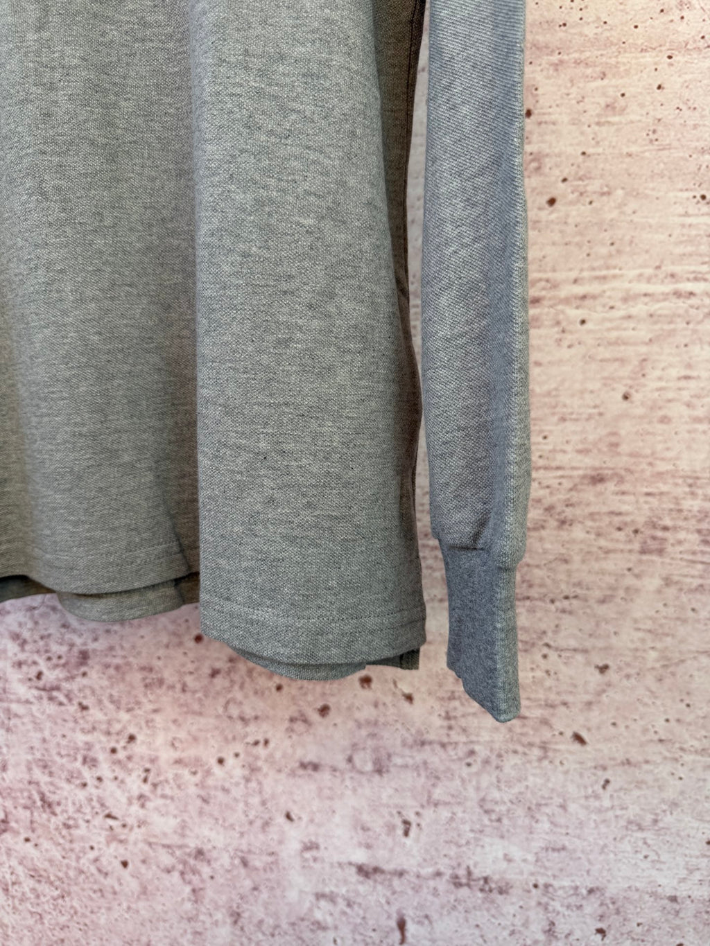 Ralph Lauren heather gray long-sleeve polo shirt, side view with hem