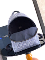 Dior mini monogram backpack, open top showing dark fabric lining