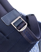 Dior mini monogram backpack strap, textured blue leather tab with silver buckle