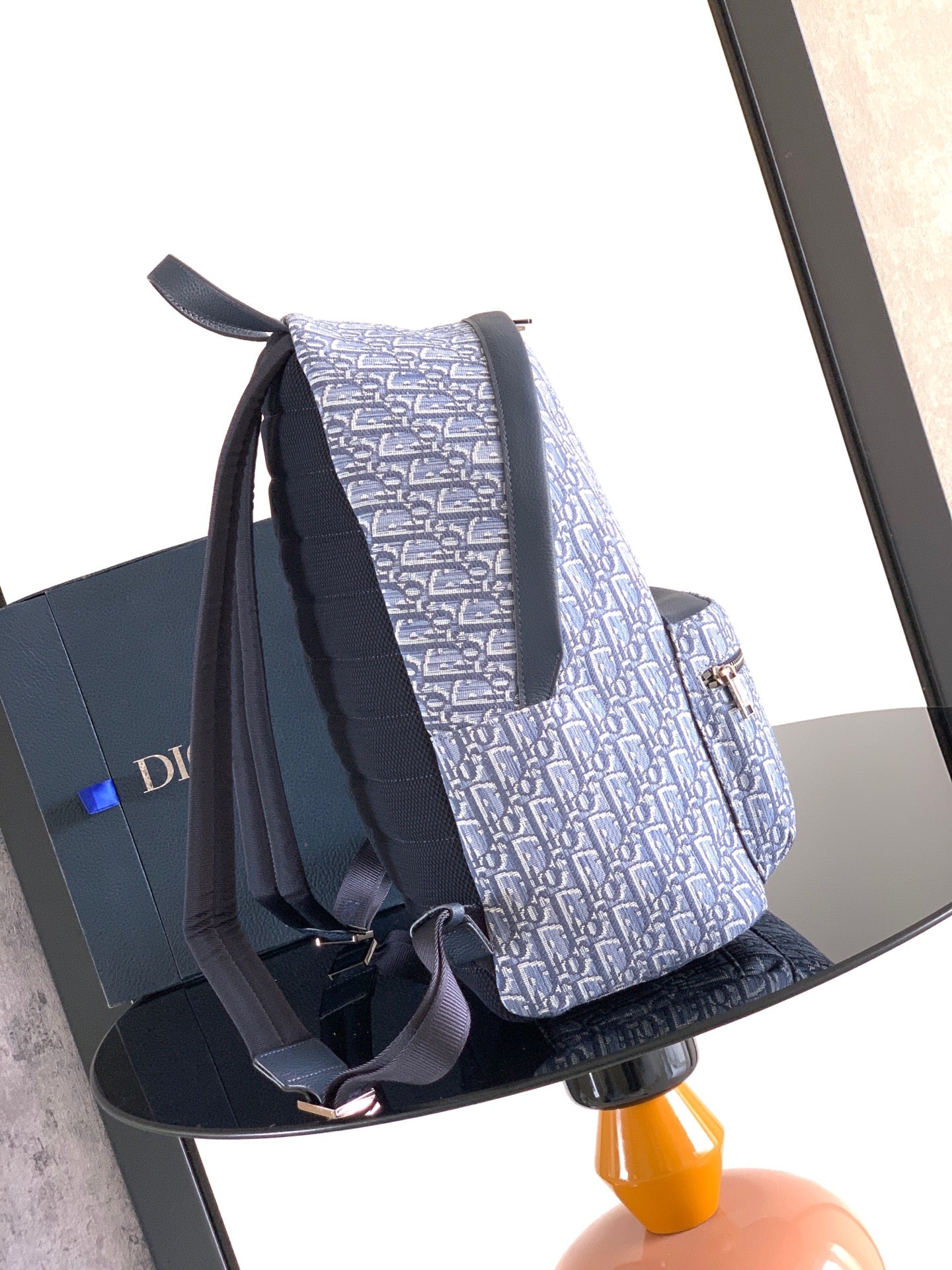 Dior men’s monogram backpack with adjustable shoulder straps and navy front band