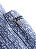 Dior men’s monogram backpack close-up of zipper and patterned fabric