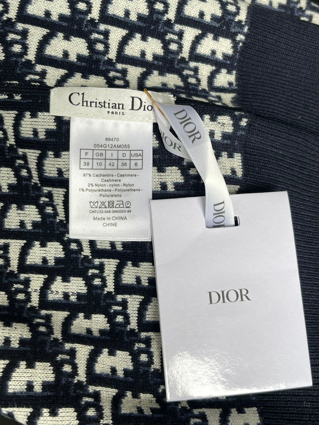Dior long-sleeve sweater with size label and Dior brand tag attached