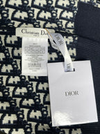 Dior long-sleeve sweater with size label and Dior brand tag attached