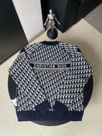 Dior long-sleeve sweater with navy and white logo pattern and 'CHRISTIAN DIOR' band