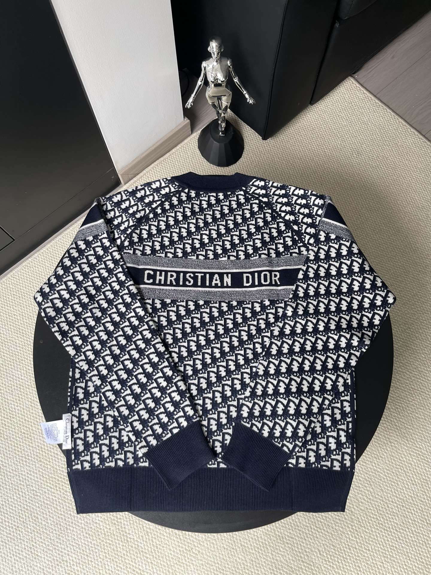 Dior long-sleeve sweater with navy and white logo pattern and 'CHRISTIAN DIOR' band