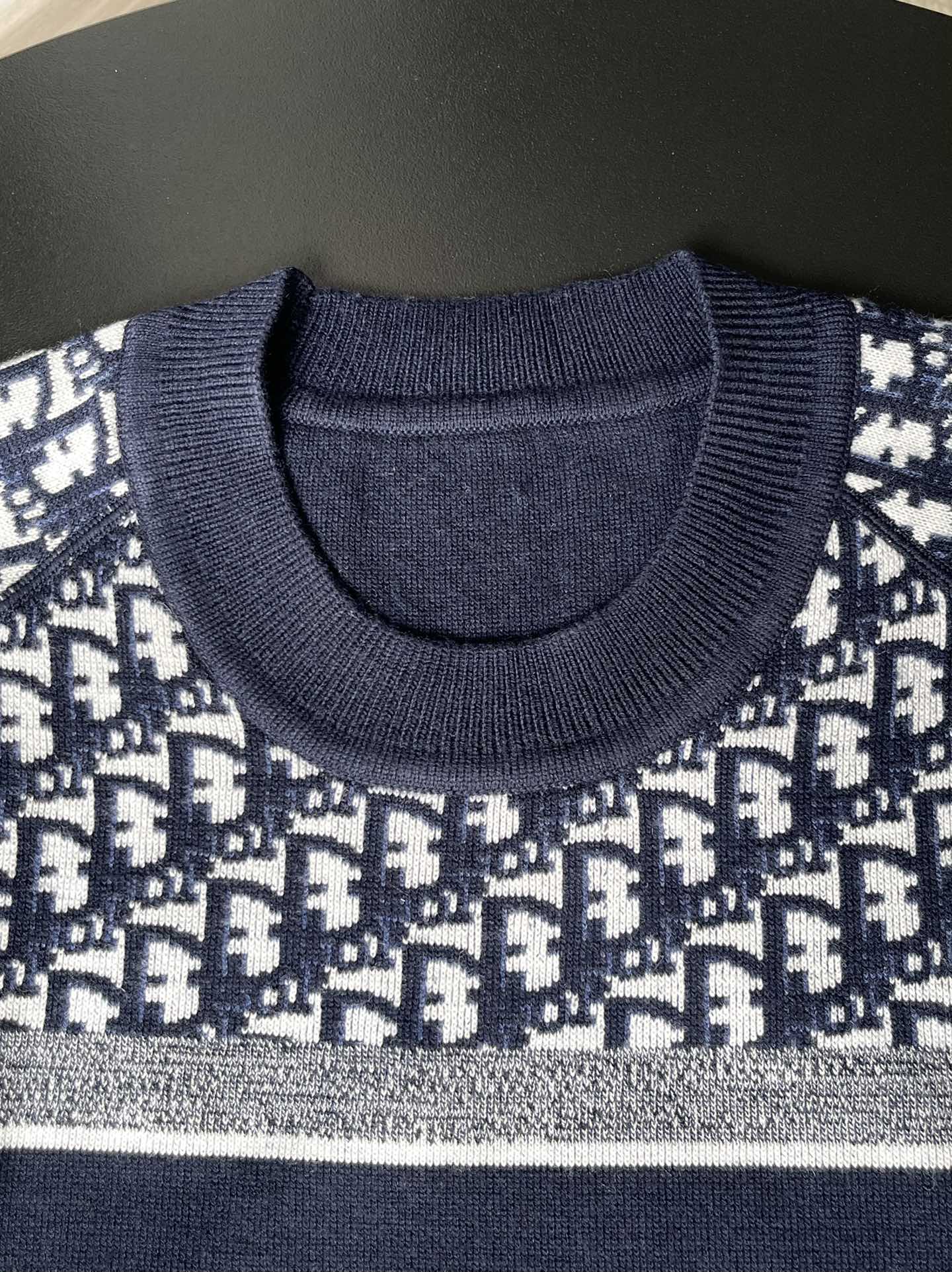 Dior long-sleeve sweater close-up of ribbed crew neck and knit texture