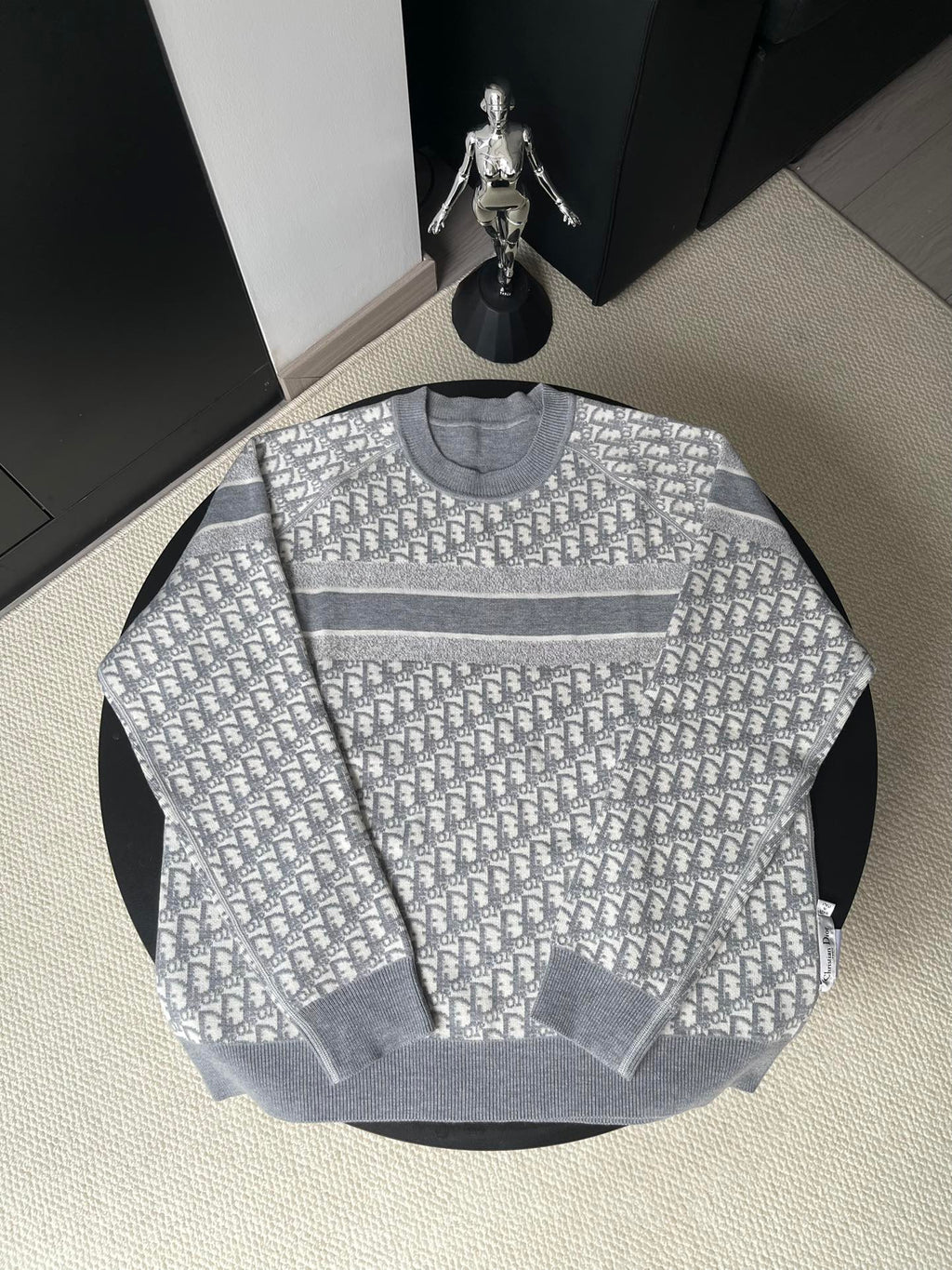Gray long-sleeve crewneck sweater with allover monogram pattern