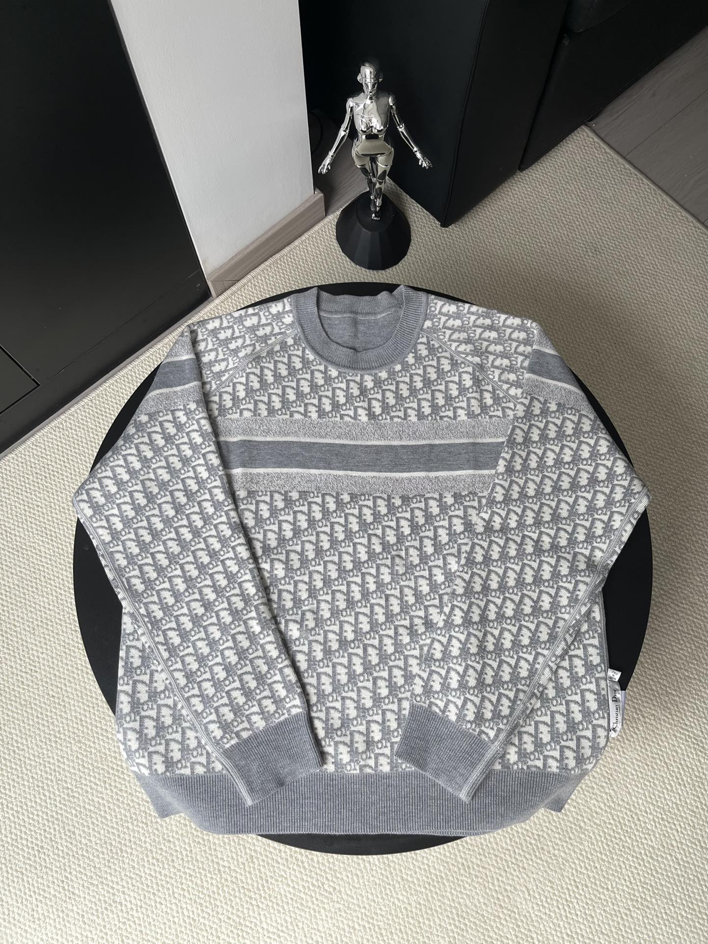 Gray long-sleeve crewneck sweater with allover monogram pattern