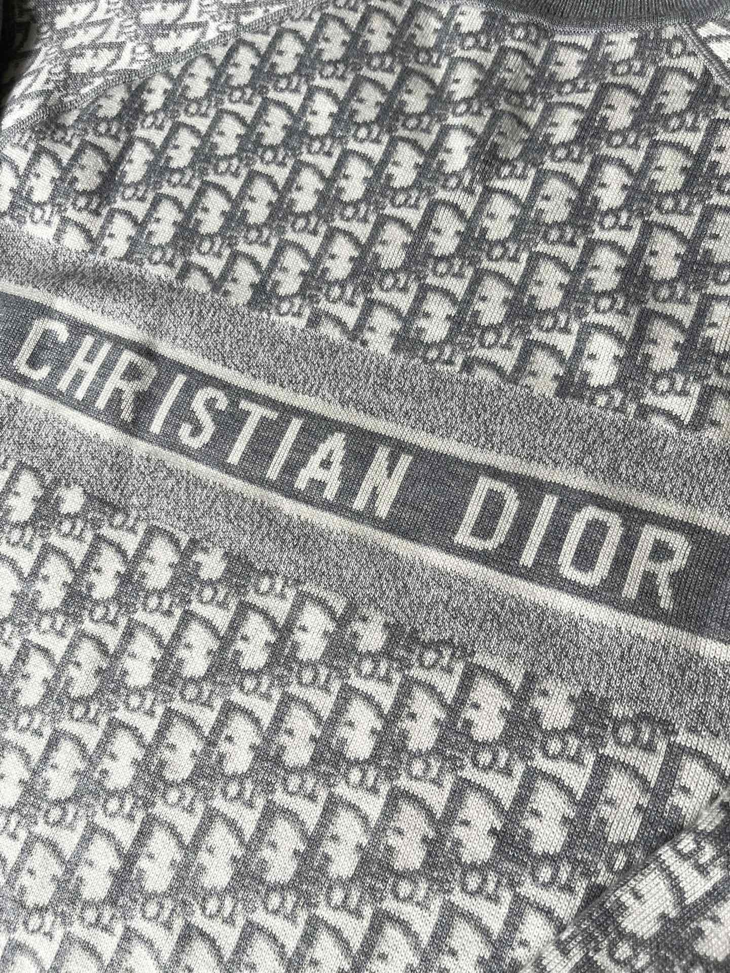 Gray sweater band with "CHRISTIAN DIOR" lettering and monogram background
