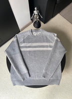 Gray long-sleeve crewneck sweater with horizontal logo stripes