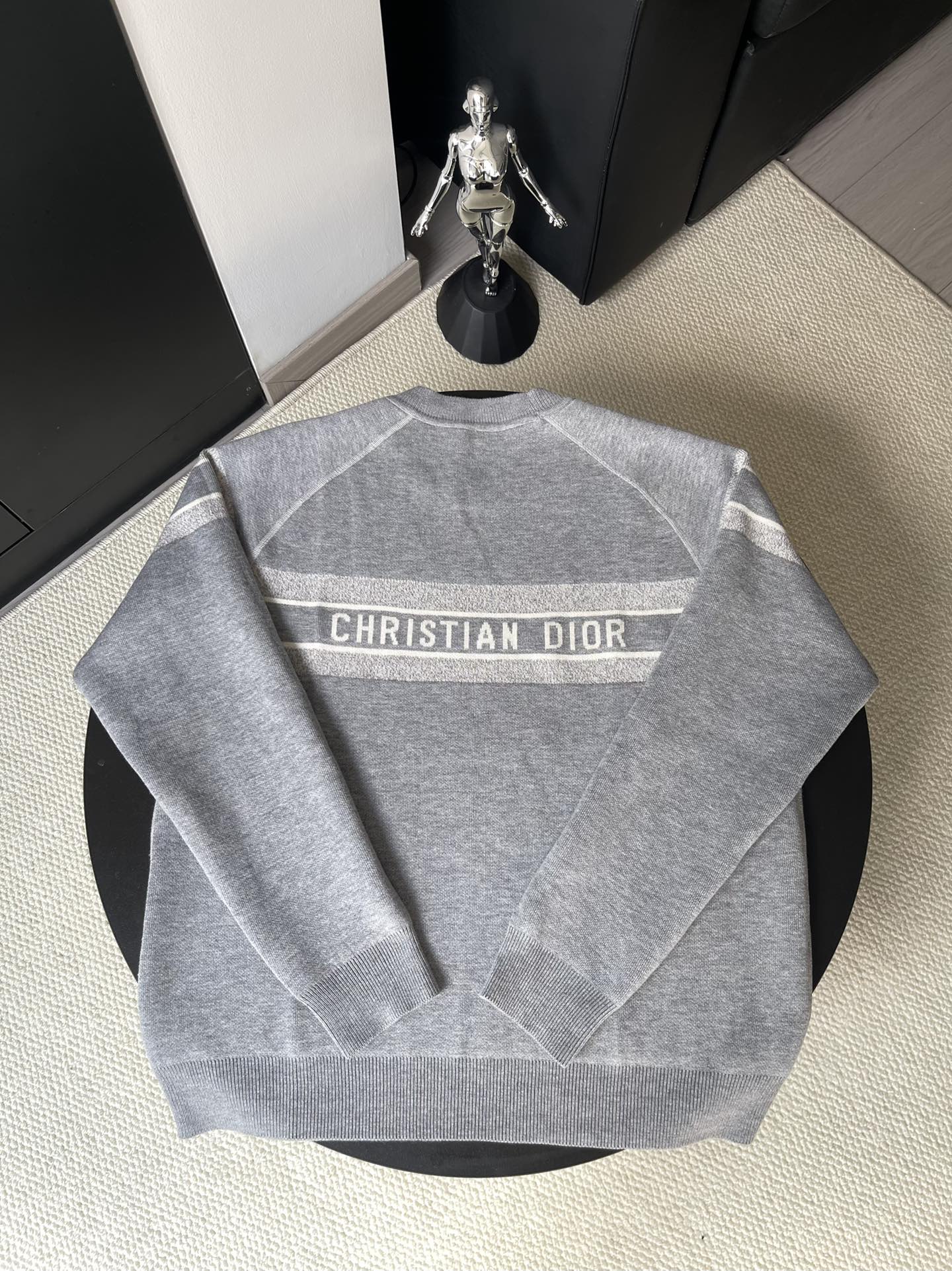 Gray long-sleeve crewneck sweater with Christian Dior logo on back