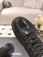 Black leather sneaker upper with Chanel CC patch and laces
