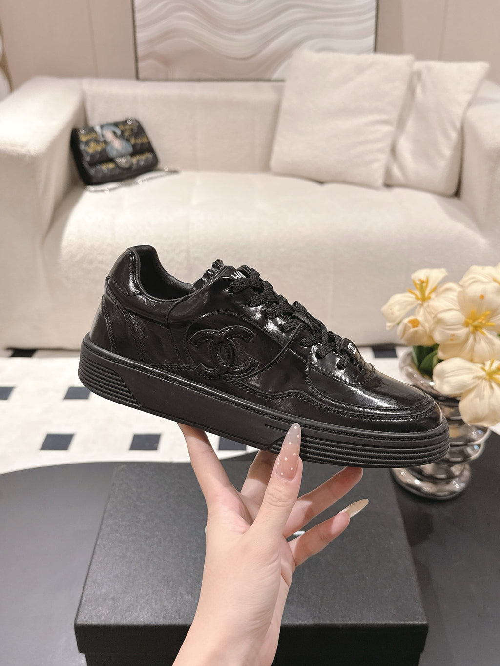 Black leather lace-up sneaker with low profile sole and side CC
