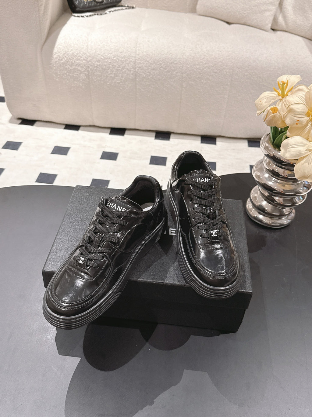 Black leather lace-up sneakers with branded tongue label