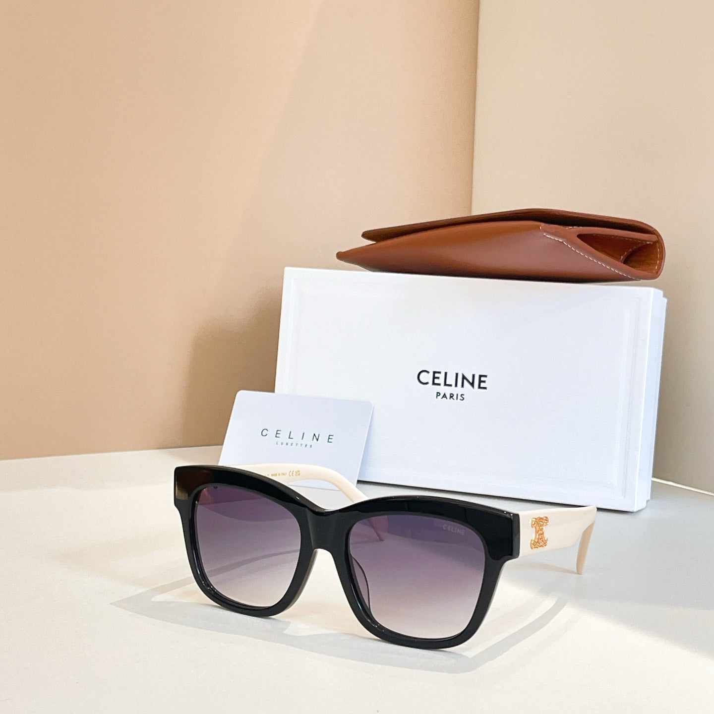 Celine sunglasses with black frames and purple-tinted lenses