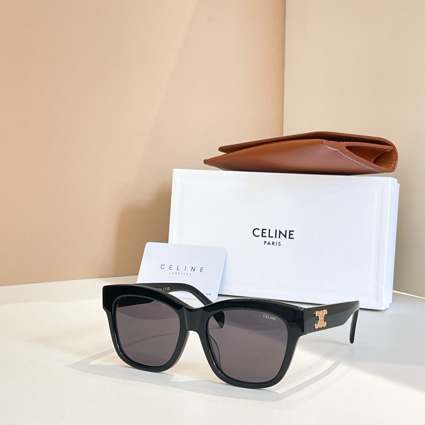 Celine sunglasses with black frames and dark brown-tinted lenses