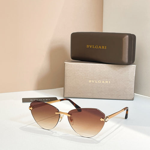 Bvlgari sunglasses with brown tinted lenses, black frame and gold temples.