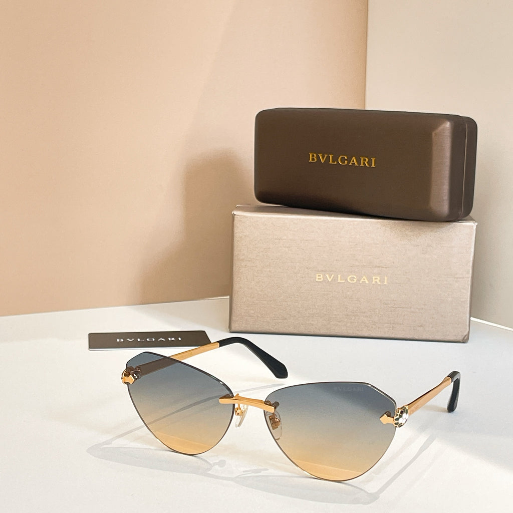 Bvlgari sunglasses with light blue tinted lenses, black frame and gold arms.