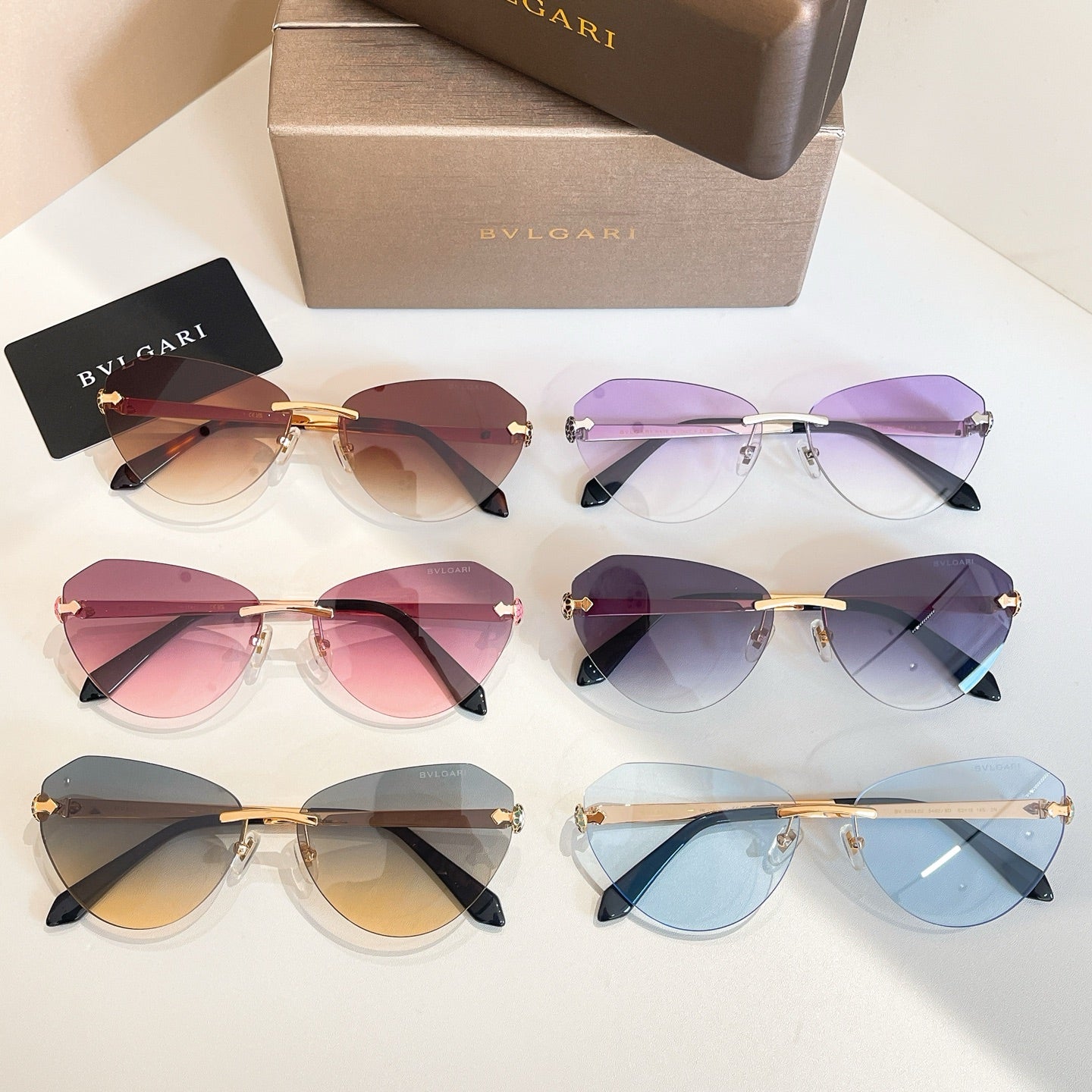Bvlgari sunglasses assortment with mixed lens colors in gold and dark frames, multiple pairs.