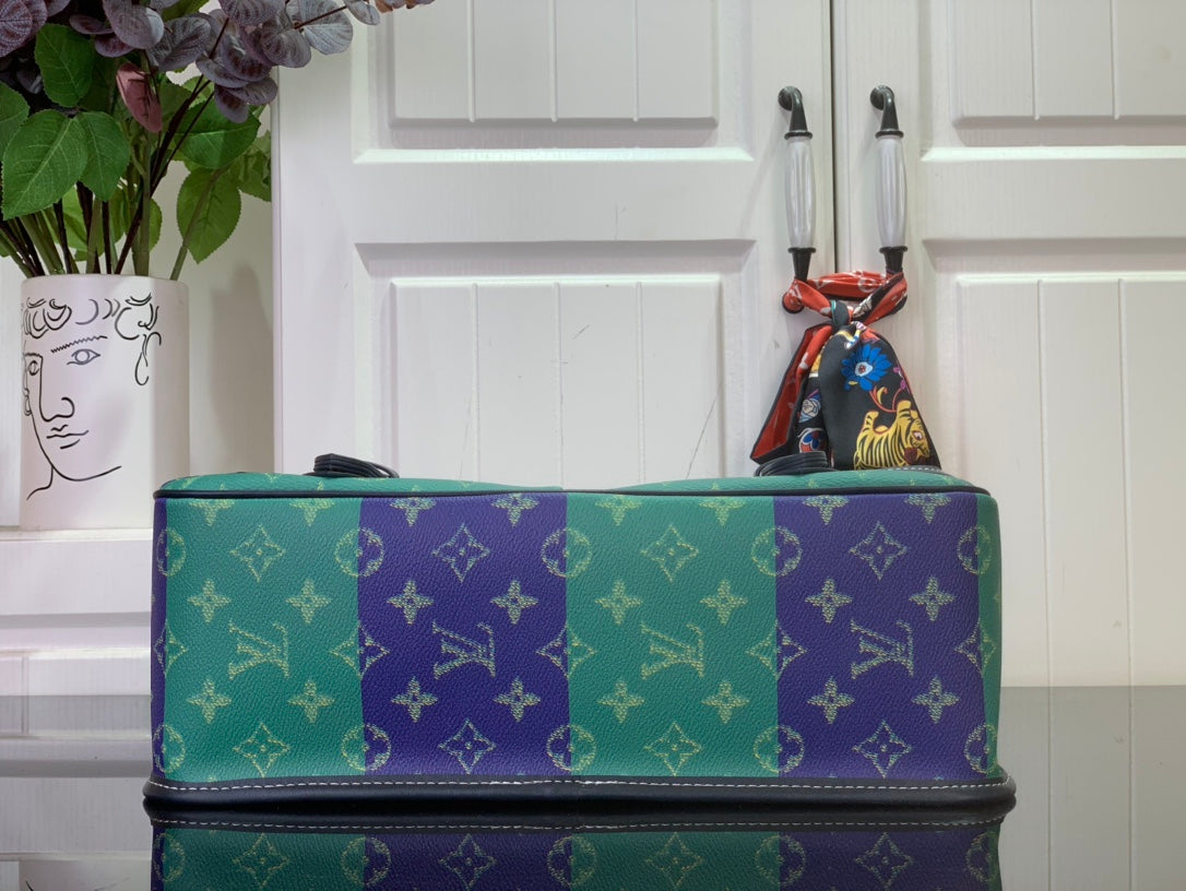 Men's Louis Vuitton bag with green-and-purple monogram exterior and stitched edges