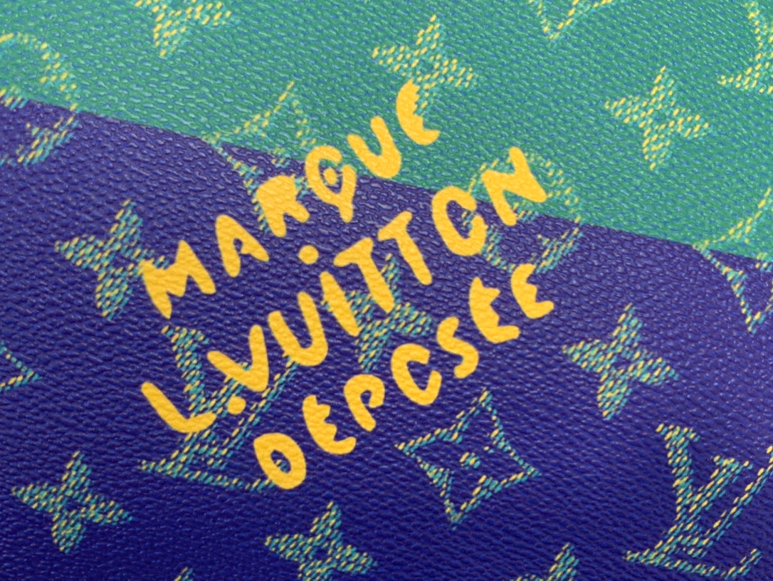 Louis Vuitton Paris monogram text on purple fabric with gold lettering