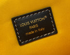 Louis Vuitton Paris made in Italy label on tan fabric with stitched border