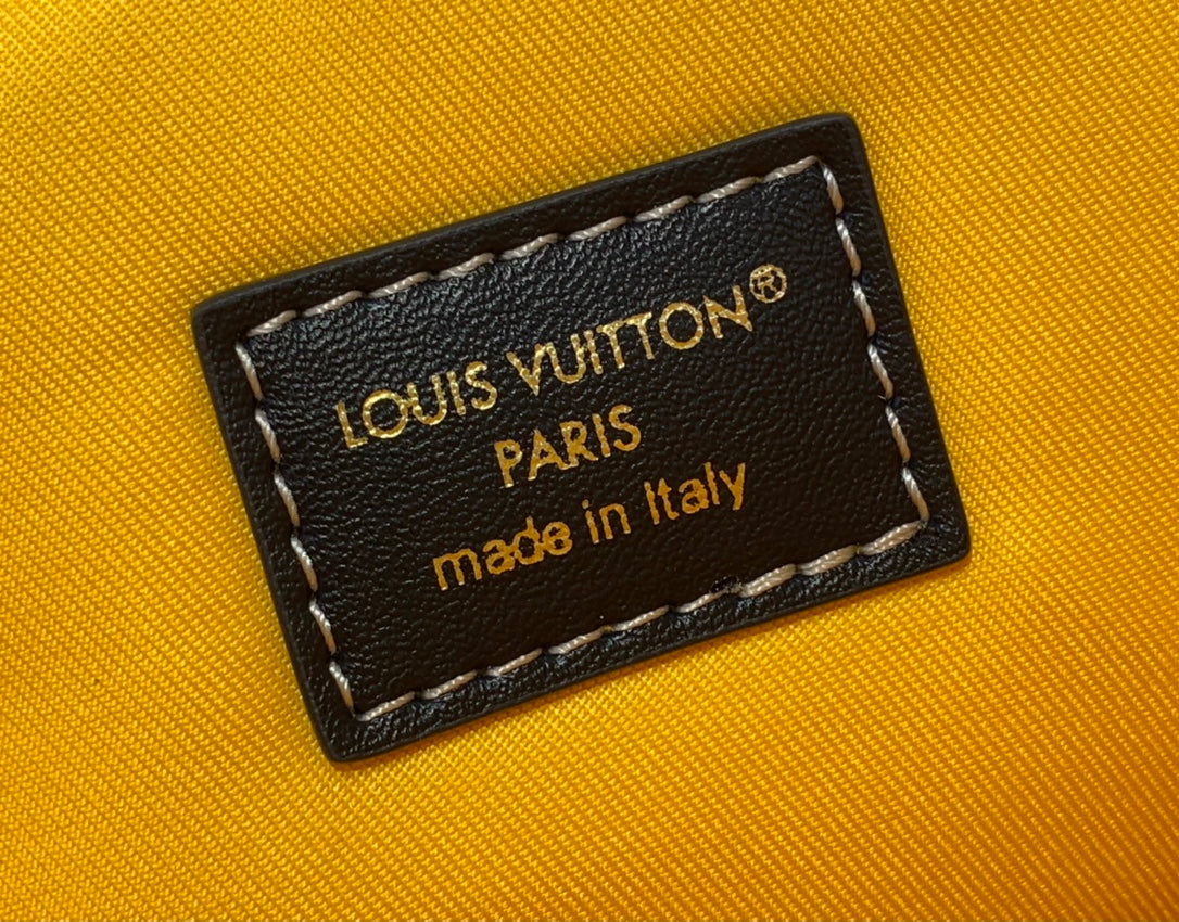 Louis Vuitton Paris made in Italy label on tan fabric with stitched border