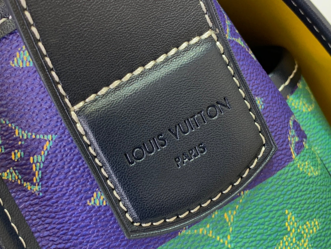 Leather label patch on monogram shoulder bag, reading Louis Vuitton Paris