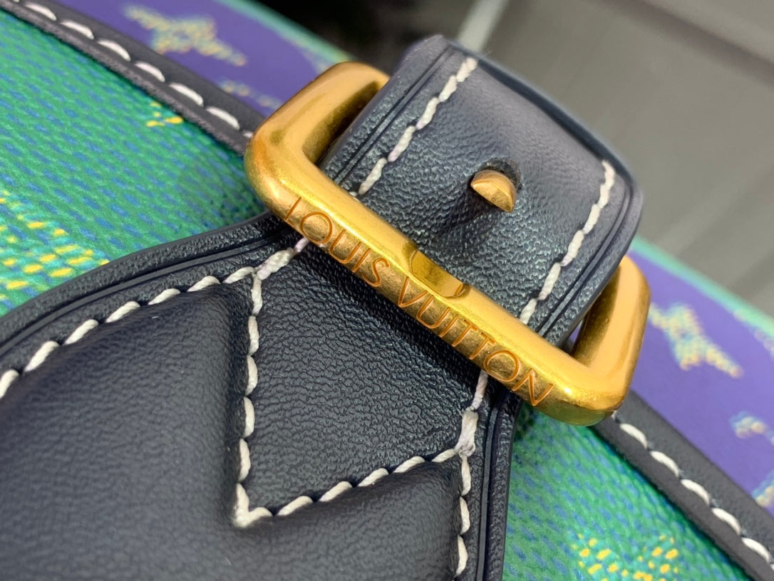 Louis Vuitton gold buckle strap detail with black leather trim and contrast stitching