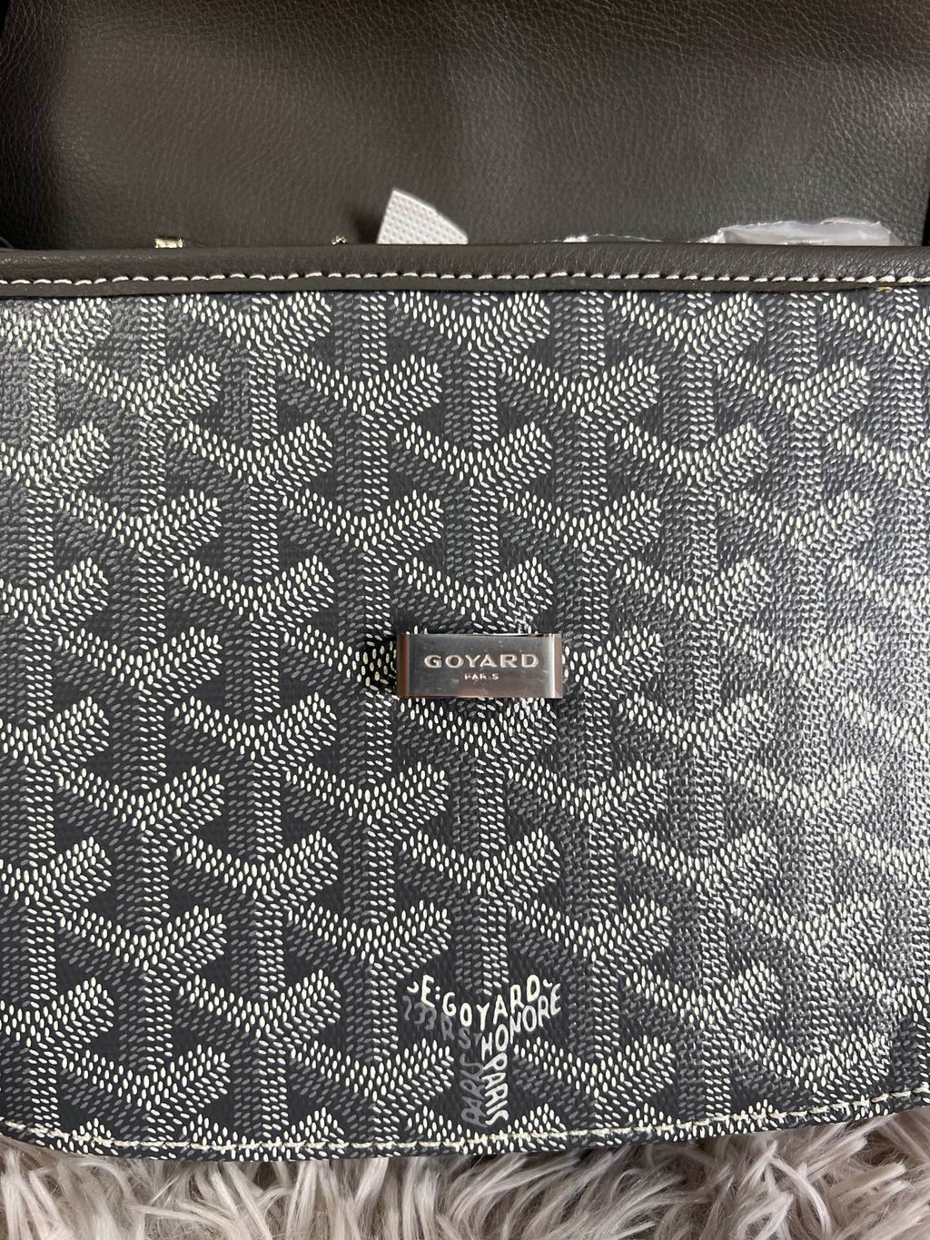 Back panel of monogram crossbody bag with Goyard logo patch