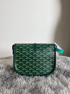 Green patterned Goyard crossbody bag with front flap and adjustable shoulder strap