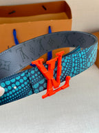 Grey monogram lining belt with red LV buckle over turquoise patterned strap.