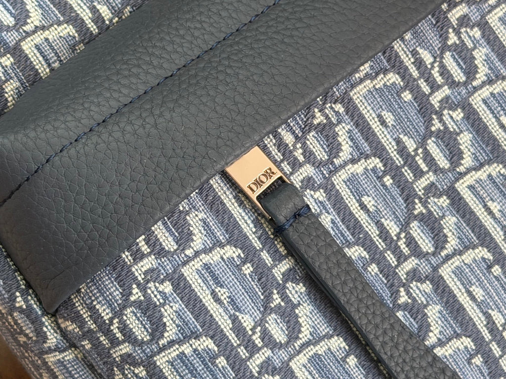 Leather Dior logo patch on navy trim over blue Oblique jacquard