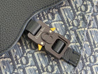 Dior men's bag hardware close-up on blue monogram canvas flap