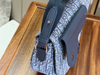 Dior men's shoulder bag with blue monogram fabric and grained leather side panel