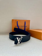 Navy Louis Vuitton leather belt with silver-tone LV buckle, shown with strap looped.