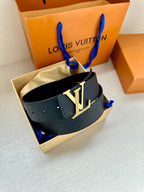 Navy Louis Vuitton embossed belt with silver-tone LV buckle, displayed in packaging.