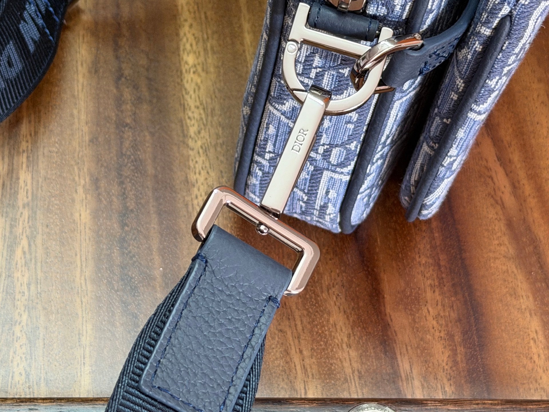 Dior blue Oblique bag with D-ring belt loop and leather strap tab