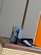Dior men's crossbody bag with blue Dior pattern, front strap, and silver-tone hardware
