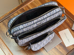 Blue Dior monogram mini bag with dual zip openings and interior pouch