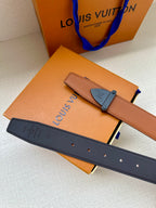 Tan and dark blue leather belt with dark blue buckle hardware