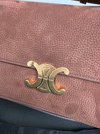 Celine bag front flap with gold logo detail on textured brown leather
