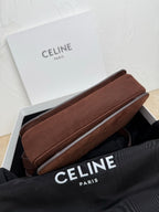 Celine bag with slim rectangular shape in textured brown leather on display