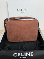Celine shoulder bag in textured brown leather with top handle, back view