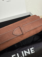 Celine bag strap and buckle detail in textured brown leather with stitching