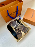 Louis Vuitton monogram belt with oversized silver LV buckle and dark strap