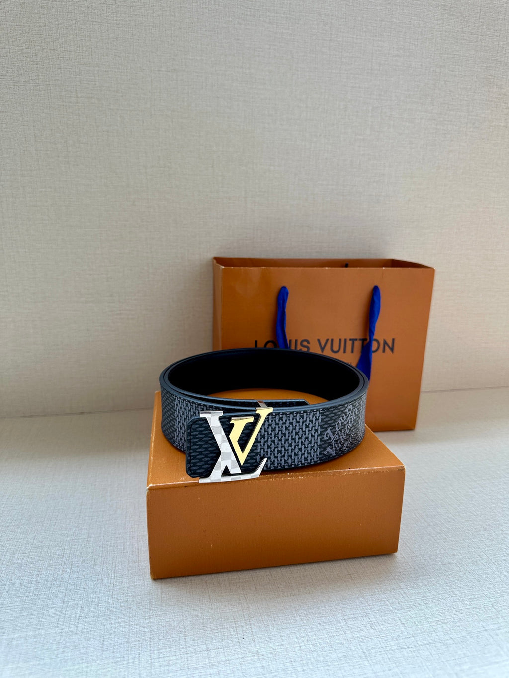 Dark blue patterned belt with gold-tone LV-style buckle