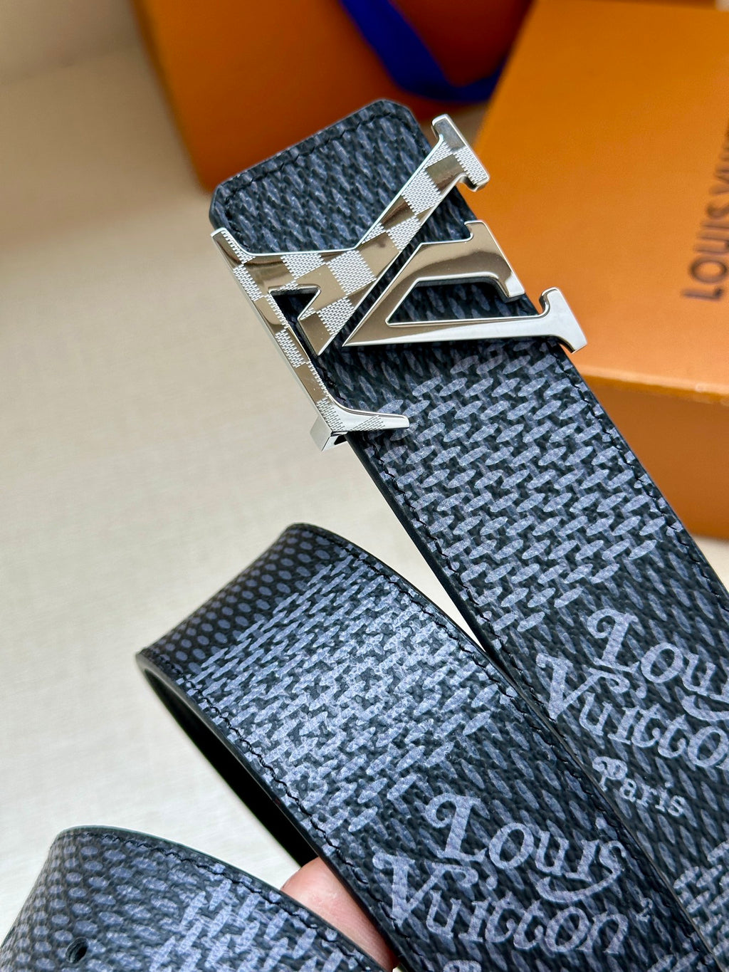 Dark blue patterned belt with large silver buckle and metallic edging