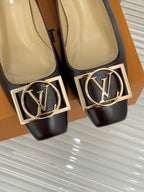 Close-up of women's dark brown square-toe pumps with gold LV logo ornament and trim